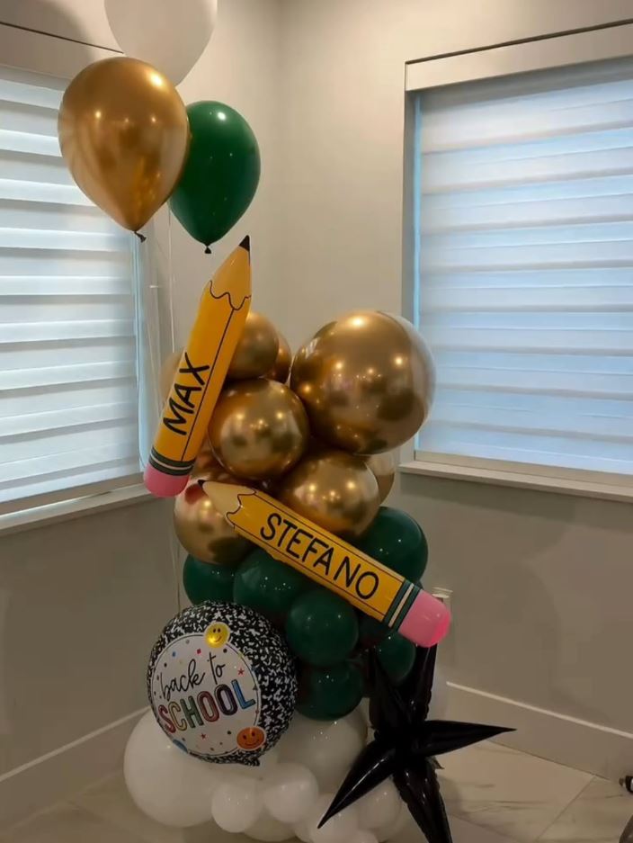 Personalized back-to-school balloon column with the names Max and Stefano on giant pencil balloons